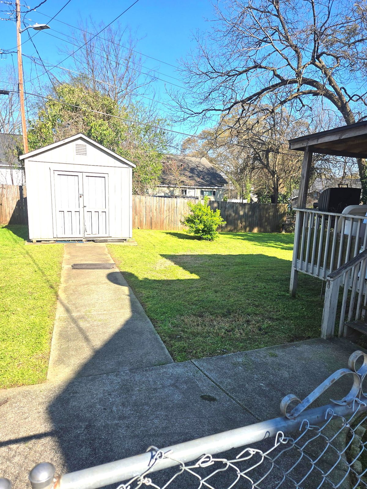 Freshly mowed backyard with shed